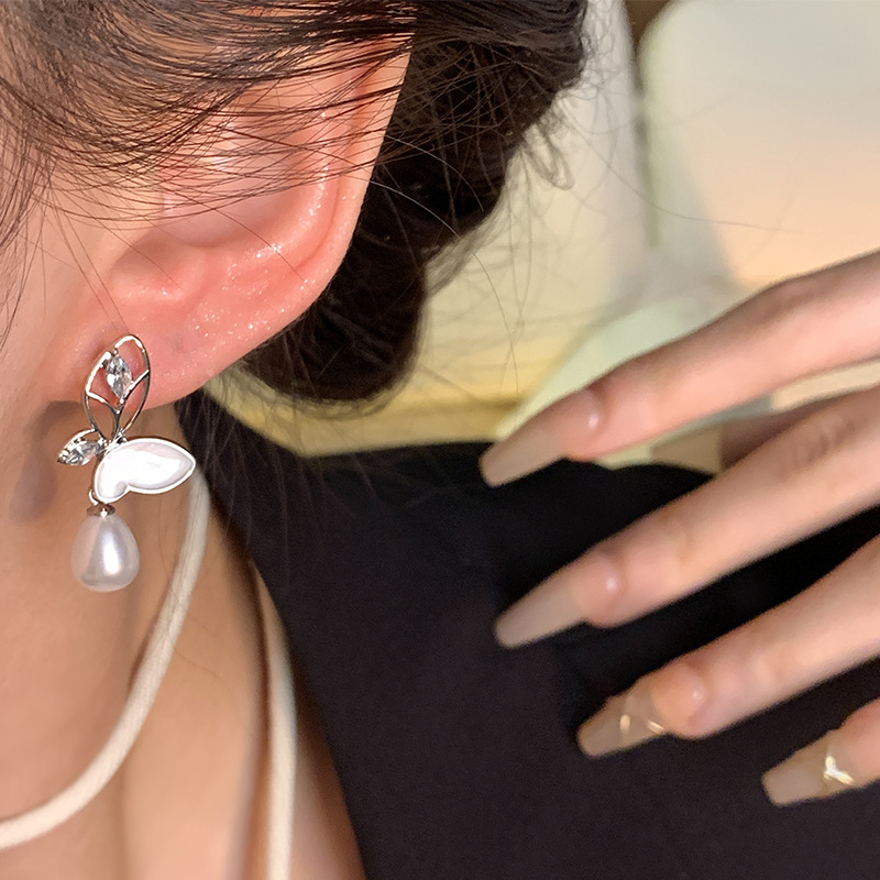 S925 Silver Needle hollowed-out crystal butterfly earrings are versatile for women, exuding a light luxury and high-end feel. Pearl stud earrings are elegant and sophisticated earrings for a socialite Application Scenario