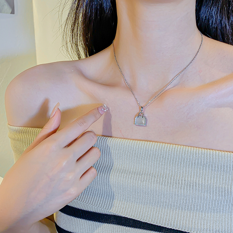 New Korean version silver cat's eye stone bag necklace, women's niche design sense, full diamond pendant, elegant and versatile collarbone chain Application Scenario