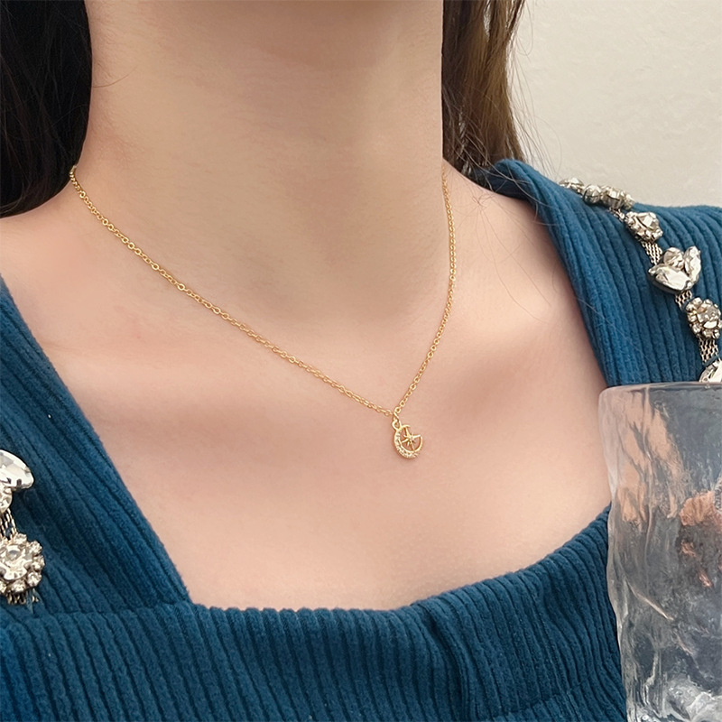 This is a unique and exquisite golden pendant necklace, a sweet star and moon zircon geometric new design with a sense of style and elegance full figure