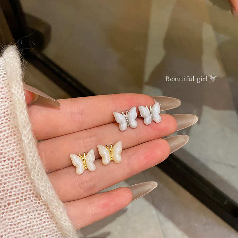 Super fairy-like white oil-dripping butterfly stud earrings for women, unique and simple earrings, light luxury and high-end elegance, wholesale of internet-famous earrings Specification drawing