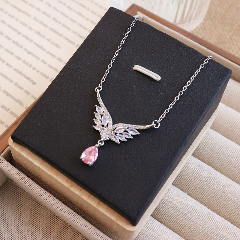 Cross-border light luxury best-selling pink water drop butterfly wing large zircon pendant titanium steel necklace, high-end women's collarbone chain Application Scenario