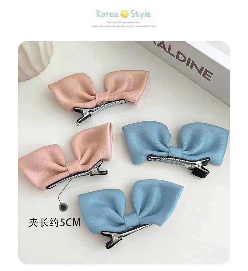 Korean-style bow hairpin children's three-dimensional fabric pleated cute small red princess-style side clip hair accessory Application Scenario