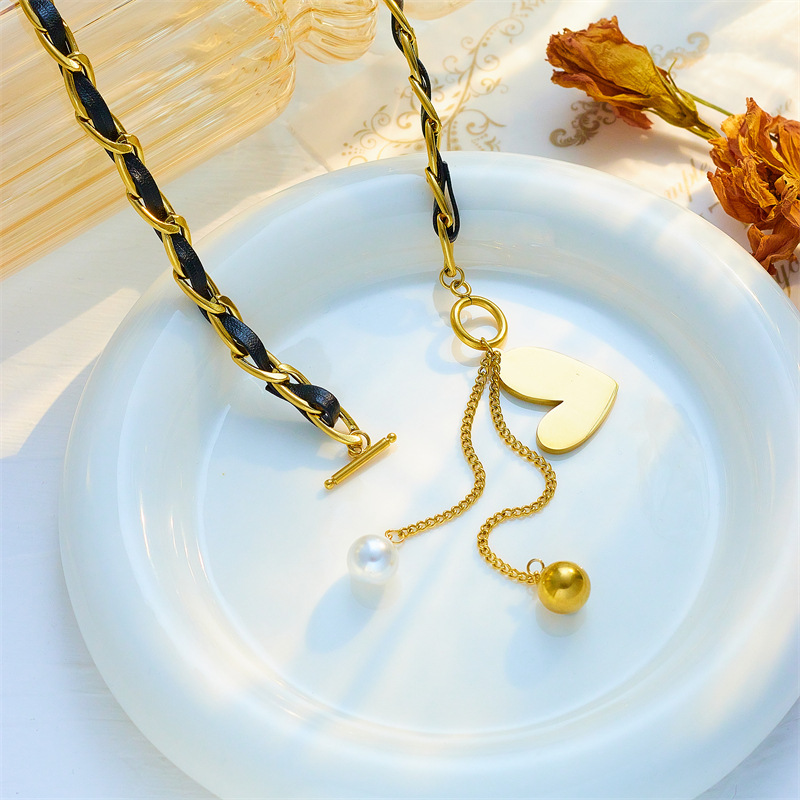 European and American cross-border titanium steel black and gold two-color chain heart-shaped round ball tassel pendant jewelry, cold style necklace details Picture