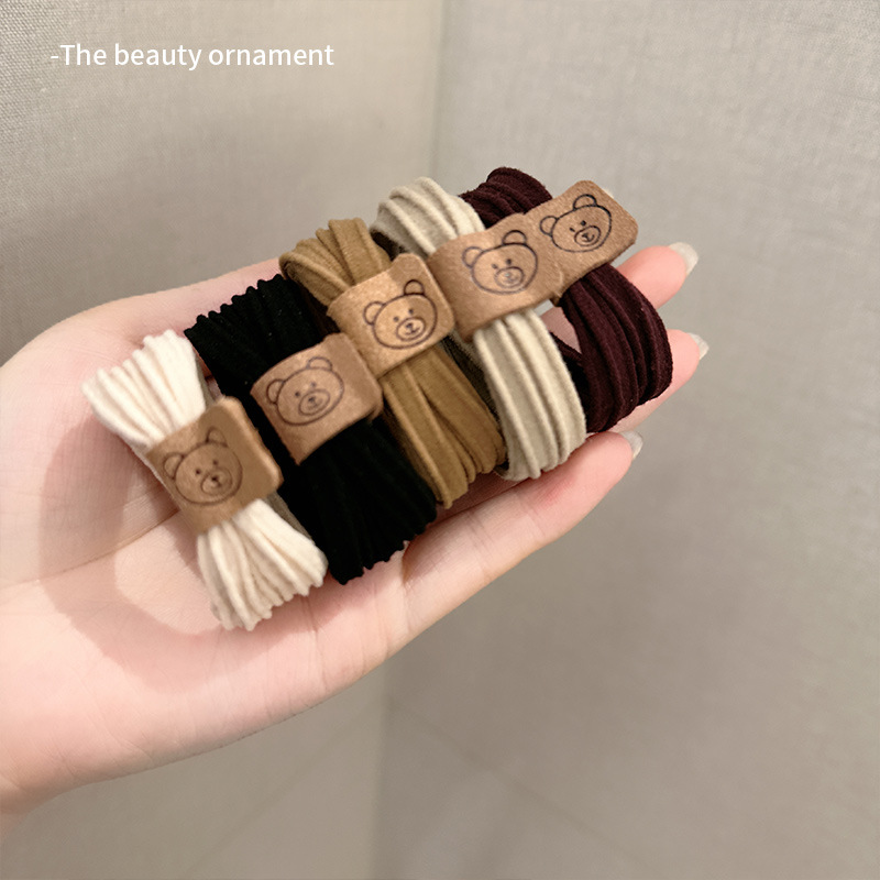 Simple, high-elasticity, seamless bear hair tie, leather band, women's hair tie, durable high ponytail headwear, hair tie and leather cover Application Scenario