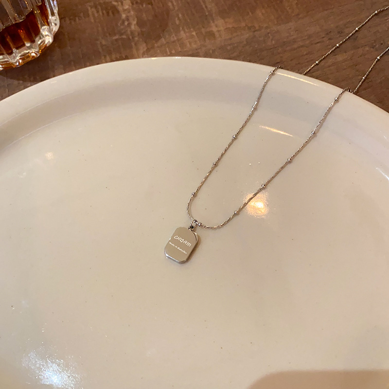Sweet and Cool Square brand letter pendant titanium steel necklace for women, 2025 new style fashionable sweater chain, daily versatile and niche accessory Application Scenario