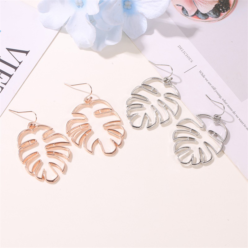 Cross-border best-selling earrings: Simple and retro ethnic style hollowed-out leaf earrings, trendy and individual banana leaf stud earrings for women details Picture