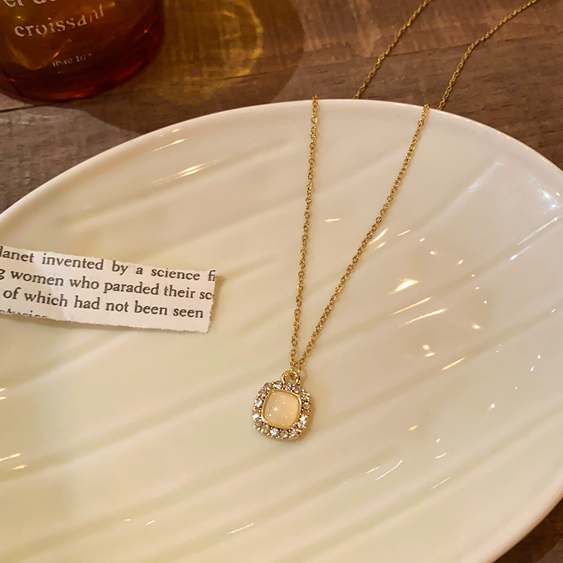 Light luxury cat's eye stone square pendant titanium steel necklace, high-end diamond-encrusted collarbone chain, elegant internet-famous sweater chain accessory Application Scenario