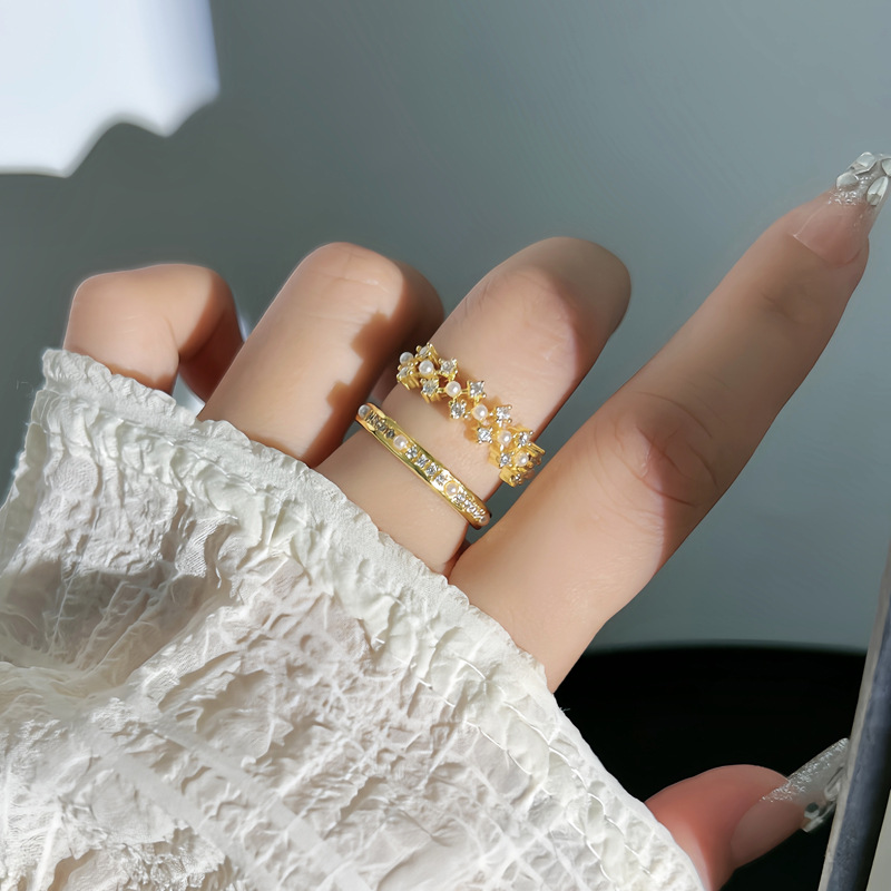 Micro-inlaid French light luxury pearl inlaid hollowed-out niche open ring, feminine, fashionable, sweet and cool stacked food ring full figure