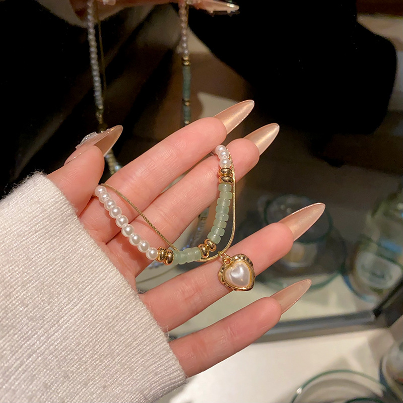 Double-layer pearl heart-shaped necklace, a trendy and versatile sweater chain for women on Instagram, with a high-end and light luxury collarbone chain accessory full figure
