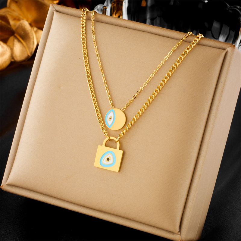 European and American fashion, niche design, simple and individual titanium steel oil drip lock head, round eye pendant, double-layer chain necklace full figure
