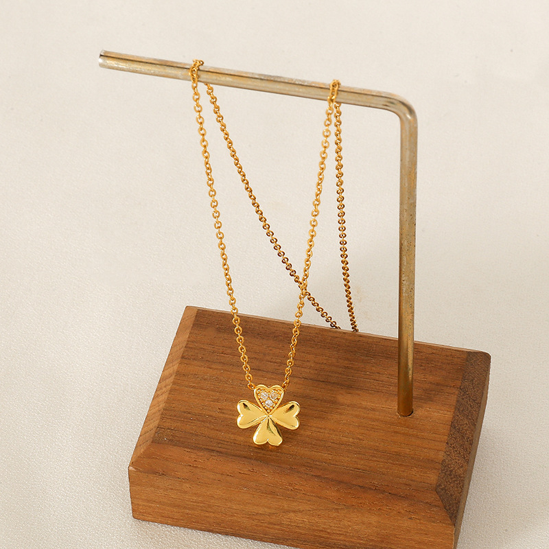 A Japanese and Korean style four-heart-shaped four-leaf clover titanium steel necklace for women, a simple silver diamond-encrusted collarbone chain, a niche internet-famous accessory Application Scenario