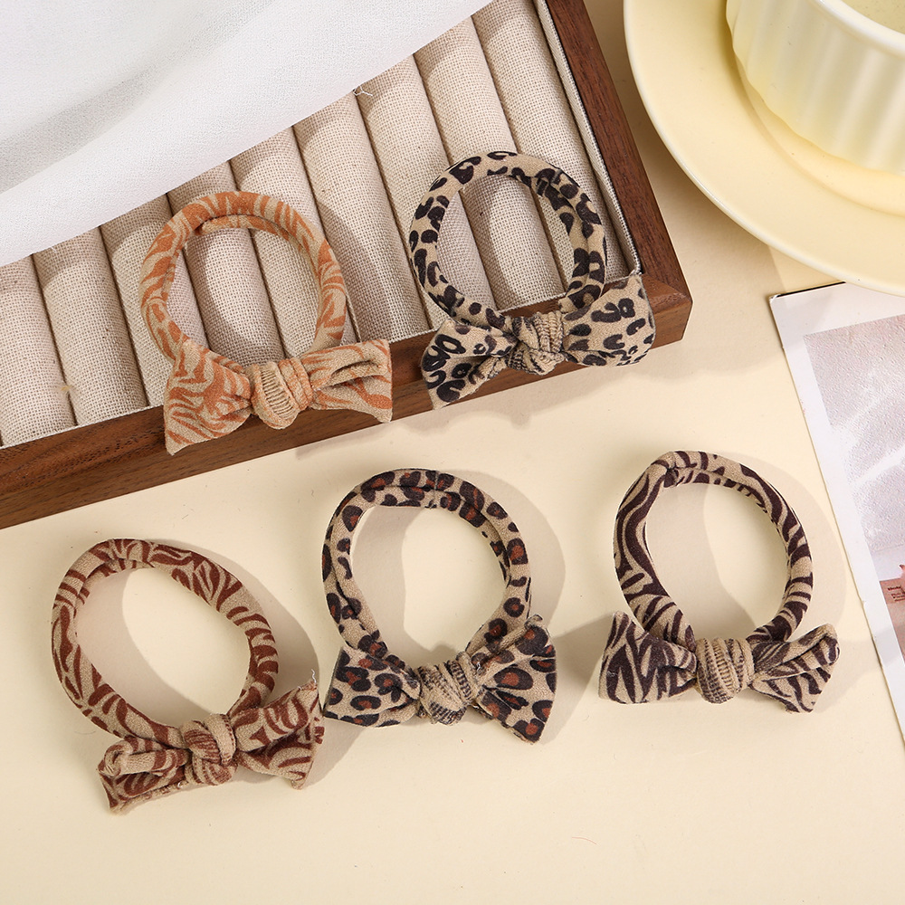 Female 2024 leopard print butterfly hair tie, rubber band hair band, high-end look, ponytail hair tie, no trace, no hair constricting Application Scenario