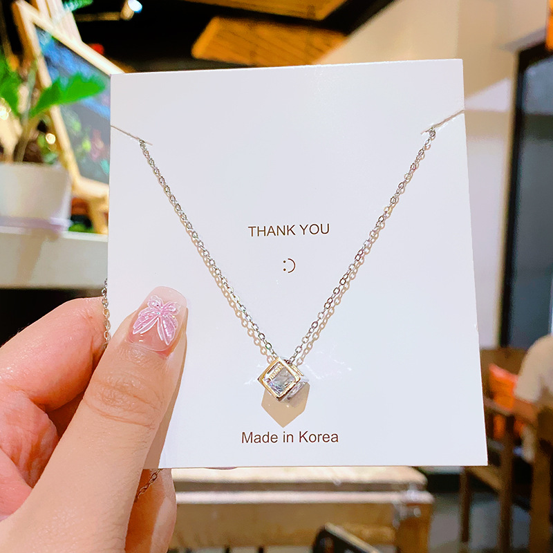 Three-dimensional square exquisite zircon pendant titanium steel necklace, a unique and high-end feminine charm, a fashionable collarbone chain accessory Application Scenario