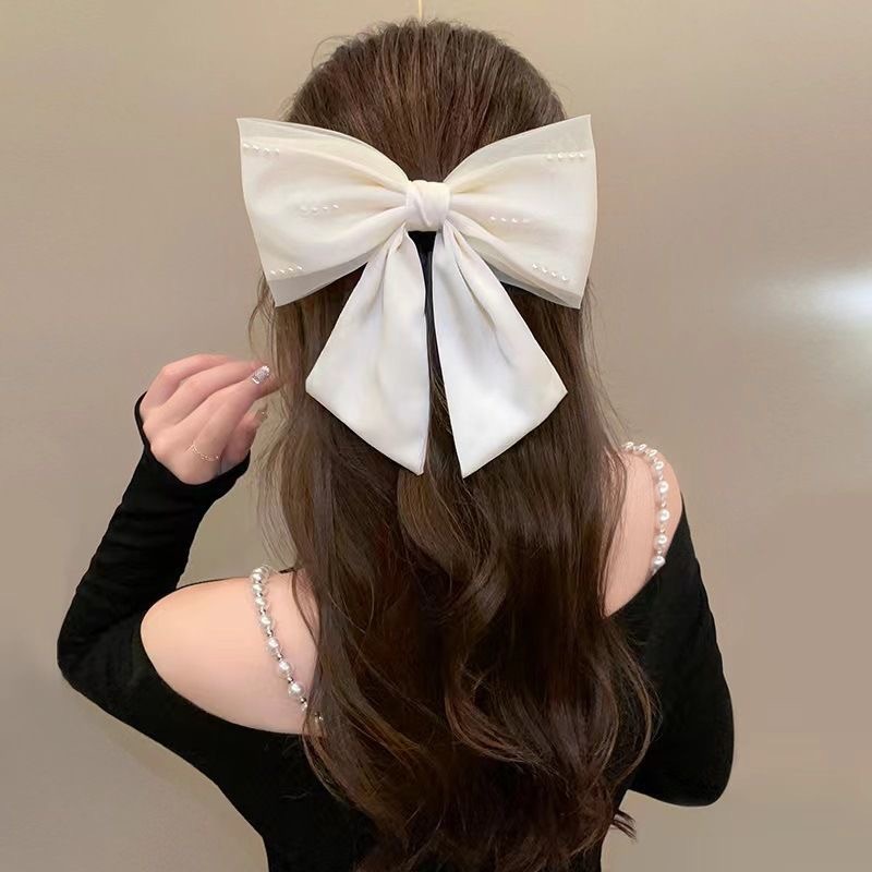 Mesh pearl black bow hair clip, women's back head coil spring clip, high-end satin top clip hair accessory Application Scenario