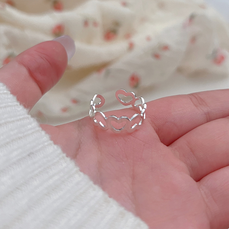 The heart-shaped hollowed-out simple and fashionable ring is exquisite, versatile, simple and good-looking. It has a trendy style and an adjustable opening for women details Picture