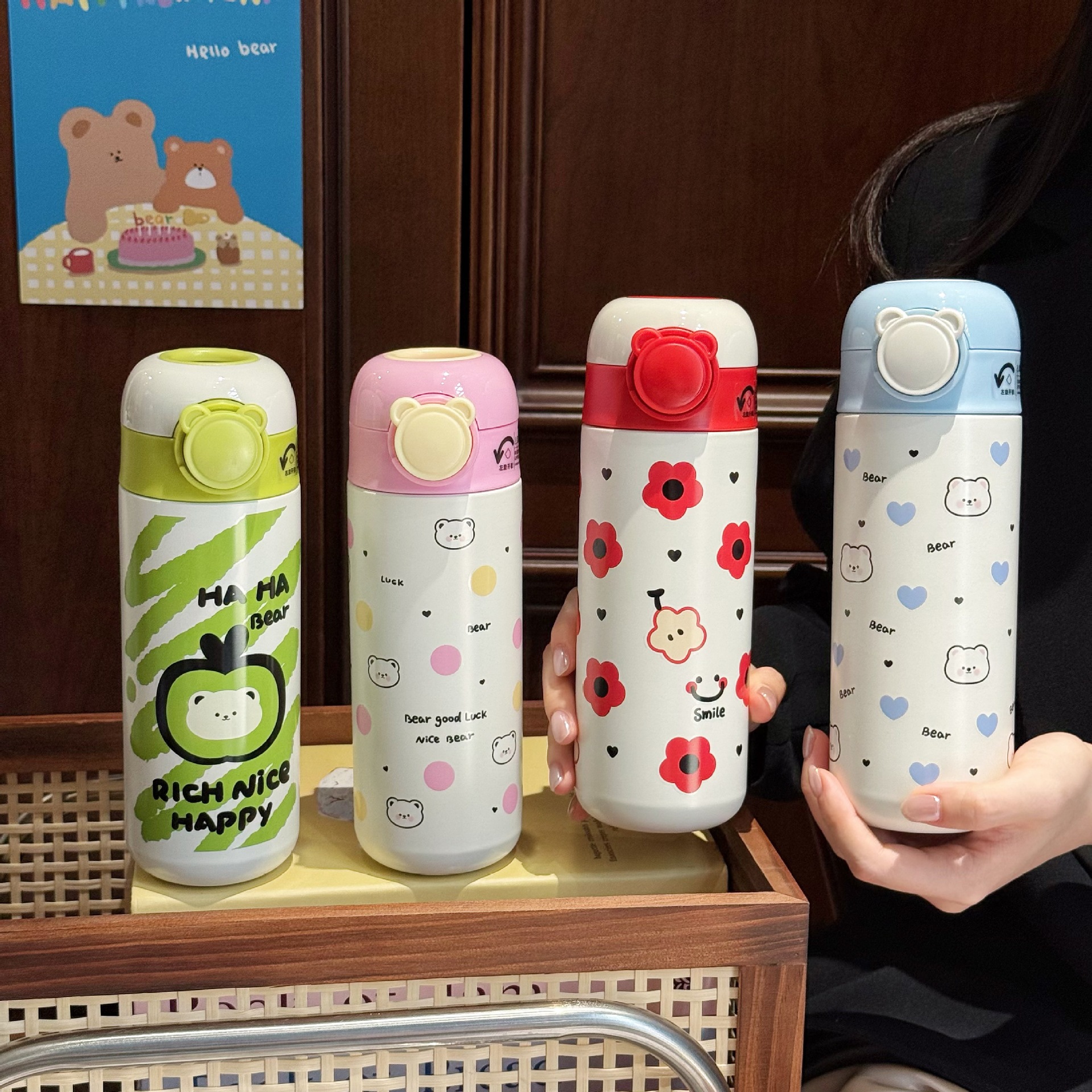 Wholesale of cartoon insulated cups, student portable hand-held elastic lid straw cups, couple stainless steel vacuum gift water cups full figure
