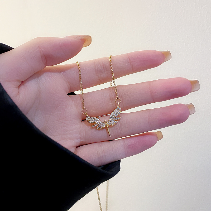 Genuine gold electroplated full diamond wing holy sword pendant titanium steel necklace, women's niche fashion design sense, versatile accessory wholesale details Picture