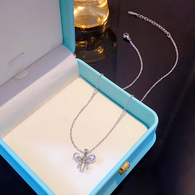 Korean version silver simple bow zircon necklace with a unique design sense for women, titanium steel collarbone chain, elegant and light luxury accessory details Picture