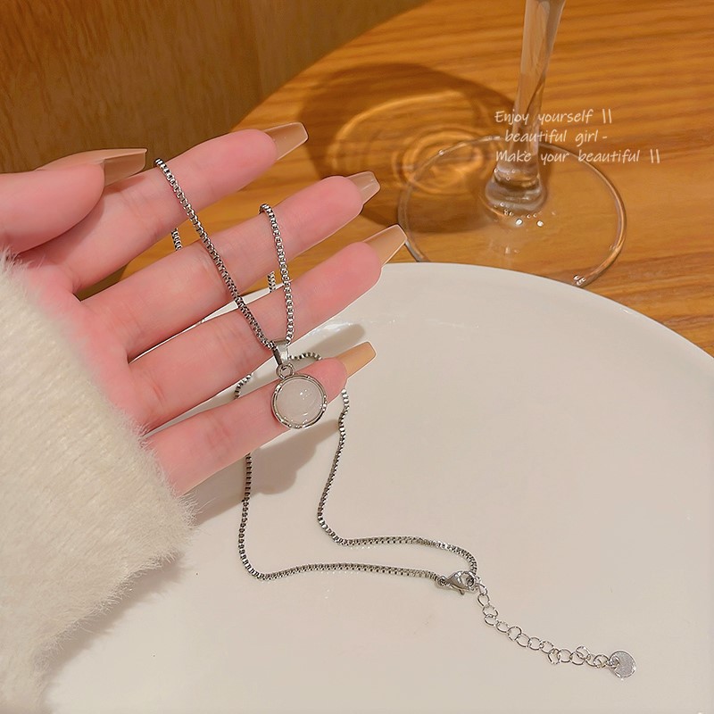 A new minimalist moonstone titanium steel necklace from South Korea, featuring an Instagram-style, light luxury and versatile style. It's the same as the popular collarbone chain full figure