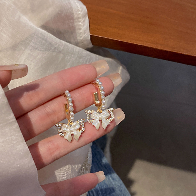 French bow pearl earrings for women, 2023 new high-end design, tassel stud earrings, versatile and popular earrings full figure