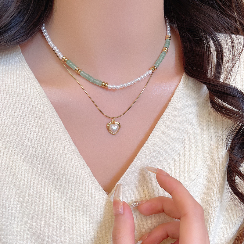 Double-layer pearl heart-shaped necklace, a trendy and versatile sweater chain for women on Instagram, with a high-end and light luxury collarbone chain accessory Application Scenario