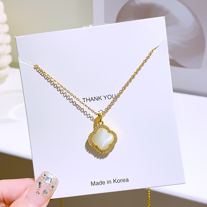 High-end cat's eye stone four-leaf clover titanium steel necklace, a unique and simple women's collarbone summer pearl light luxury style accessory Application Scenario