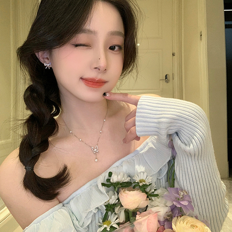 Zirconium-inlaid cat's eye stone bow earrings for women, a light luxury, niche and high-end look, cold and elegant style, a popular earpiece on the Internet Specification drawing