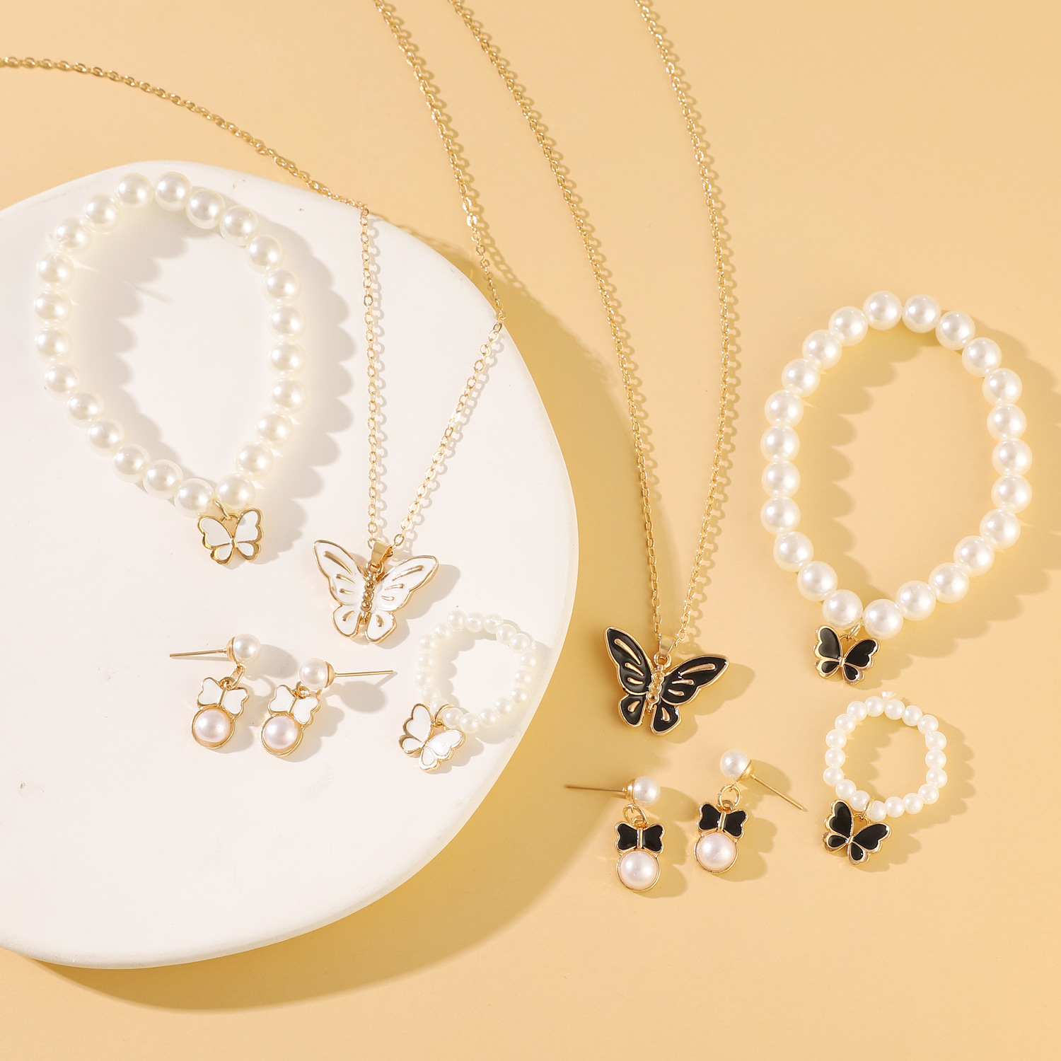 European and American versatile and personalized oil-dripping butterfly stud ring, bracelet, necklace four-piece set, fashionable pearl set jewelry for women Application Scenario