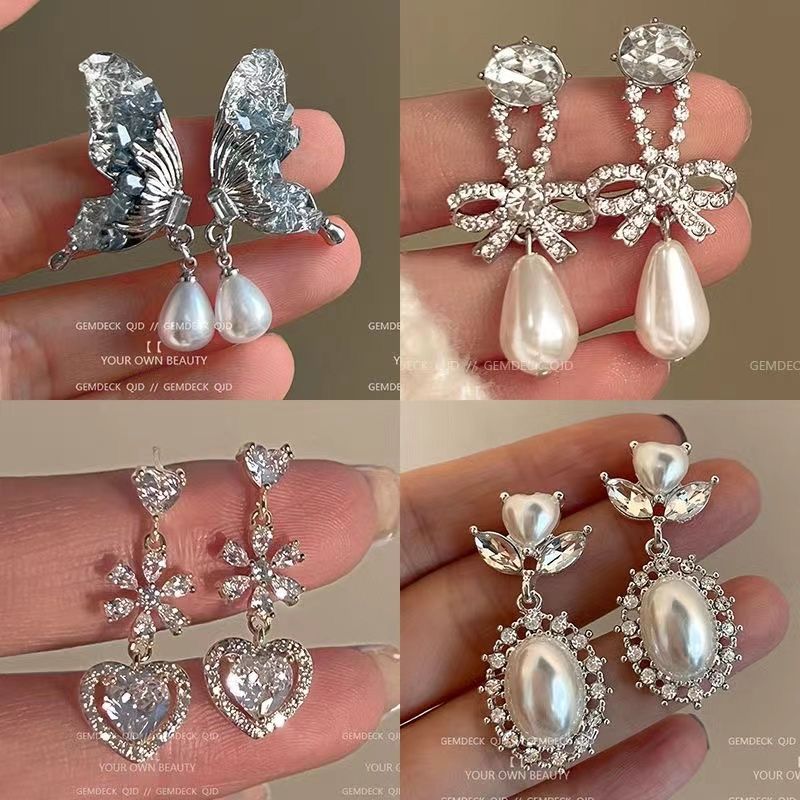 Silver needle butterfly stud earrings, pearl 2024 new light luxury earrings, French style, high-end and niche design earrings for women full figure