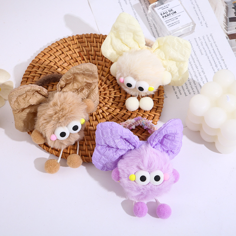 The cute plush ball hair tie for girls' hair ties won't damage hair. New style hair band for autumn and winter 2024 full figure