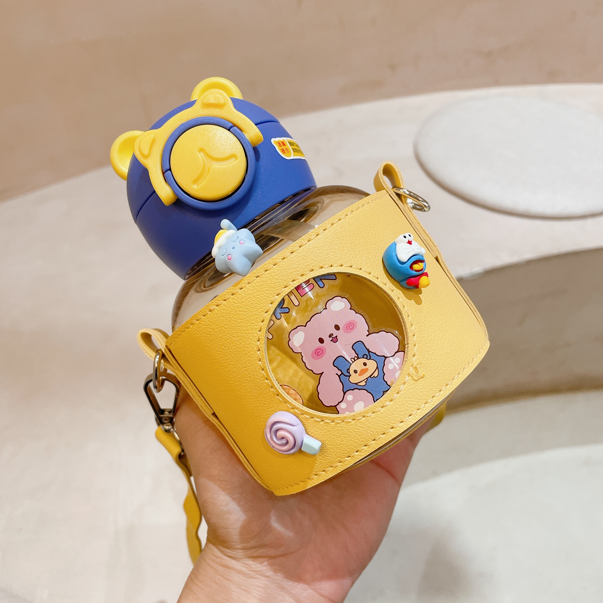 Leather case, large-belted cup with straw, portable and anti-drop children's straw cup, high appearance level for teenage girls, pop-up lid plastic baby water cup Application Scenario