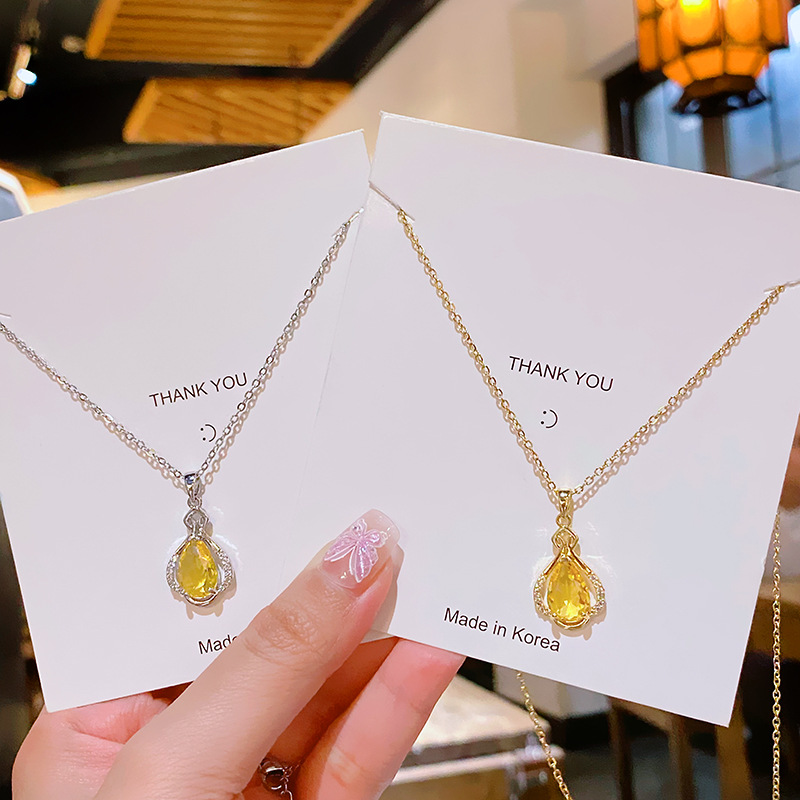 Yellow water drop zircon perfume bottle pendant, titanium steel necklace, women's niche design sense, versatile collarbone chain, elegant accessory full figure