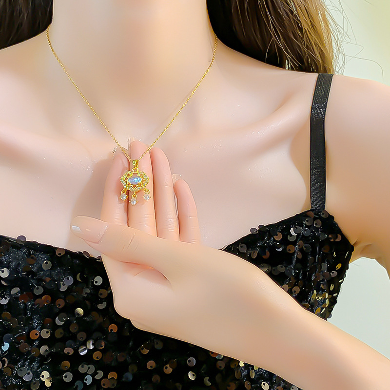 A simple and elegant Blue Spring gemstone peace lock titanium steel necklace, a women's three-tassel pendant, a new trendy collarbone chain accessory Application Scenario