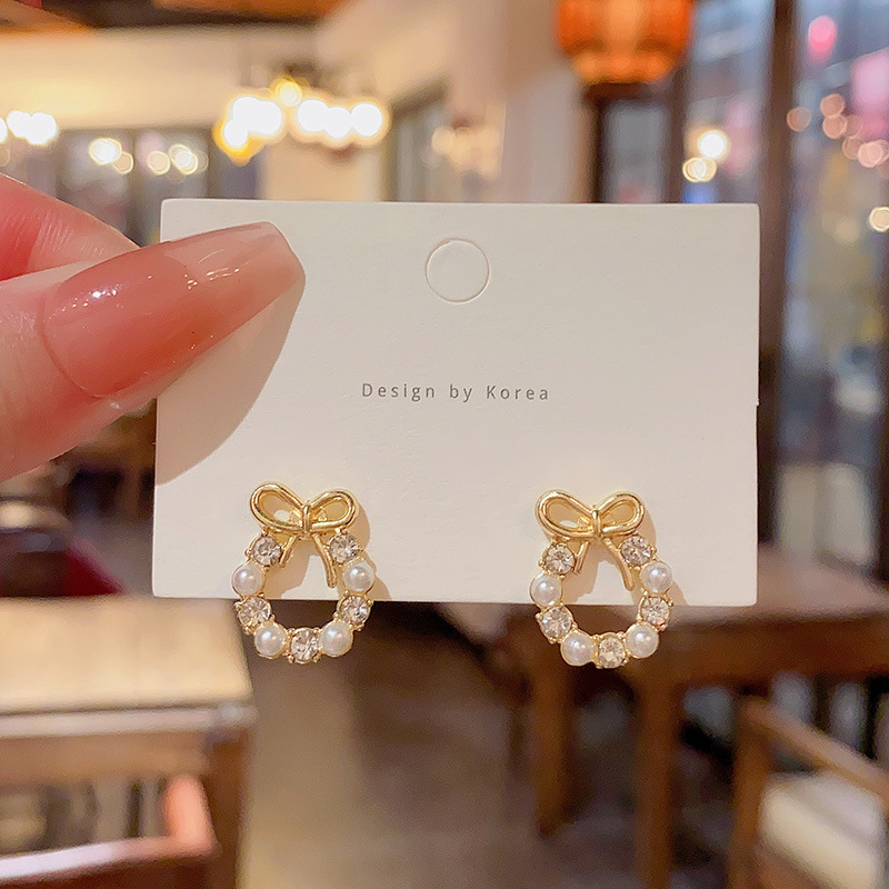 Light luxury and high-end bow earrings for women, simple Korean style pearl stud earrings, diamond-encrusted zircon versatile earrings wholesale full figure