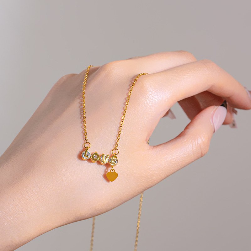 "love letter diamond-encrusted titanium steel necklace, women's heart-shaped tassel pendant, niche internet-famous light luxury collarbone chain accessory wholesale. details Picture