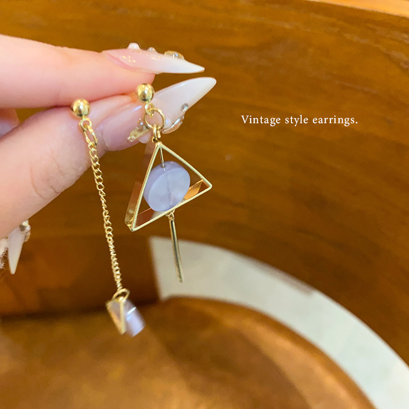 Asymmetrical triangular long tassel stud earrings, a unique and light luxury geometric earrings with a cold and unique design sense for women full figure
