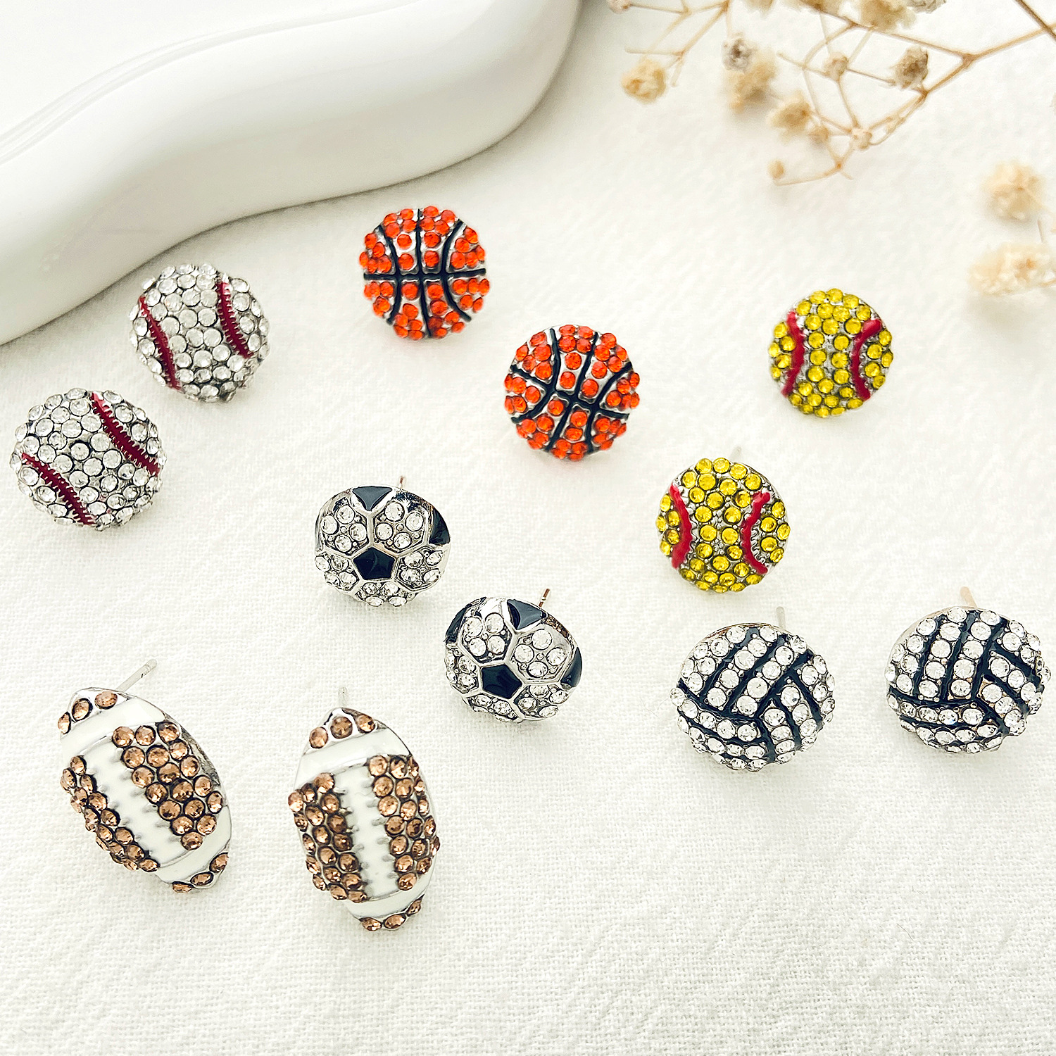 Cross-border new diamond-encrusted ball sports stud earrings for men and women, InS-style European and American creative design rugby football earrings Specification drawing