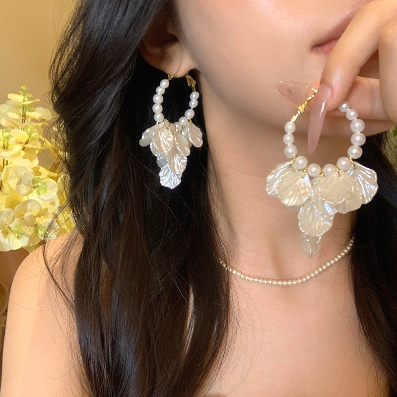Light luxury retro pearl white petal tassel earrings, exaggerated large ear rings, niche design sense, fashionable earrings Application Scenario