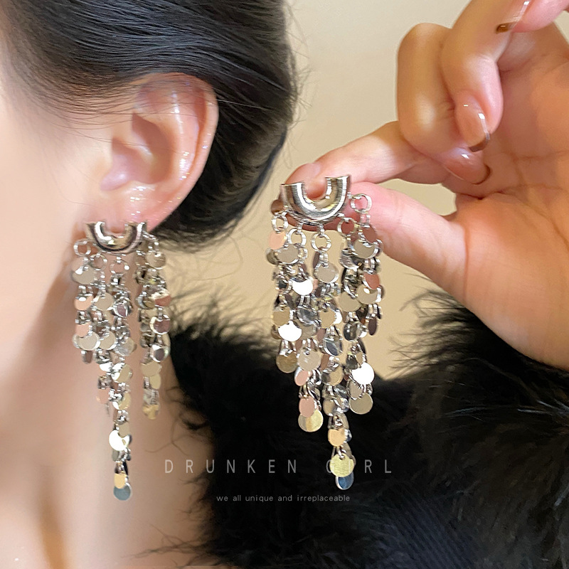 Exaggerated and high-end golden sequined tassel earrings for women, a niche and exaggerated look that makes the face look smaller, a unique Hong Kong-style metallic earpiece details Picture