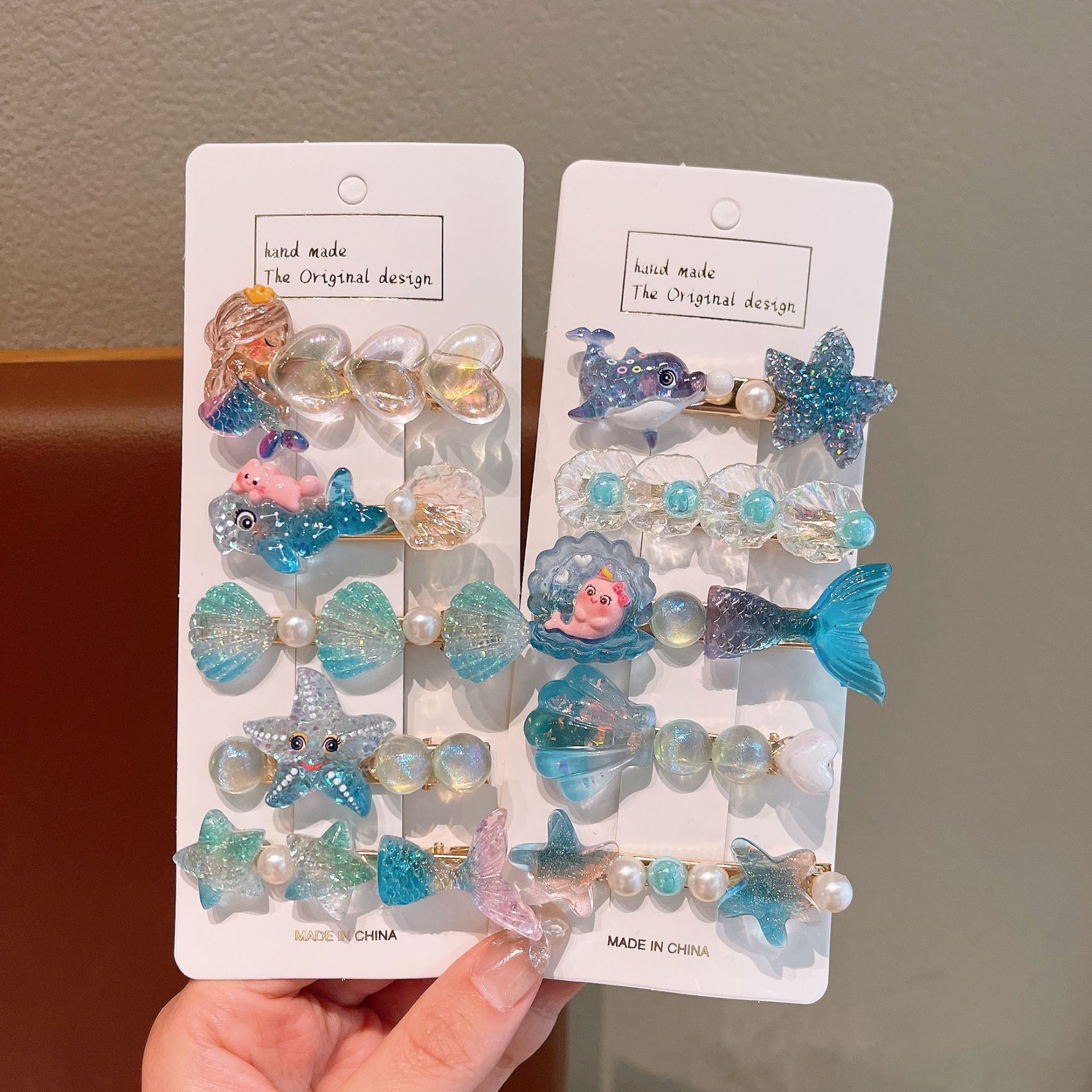 The new children's cute ocean series hair clips, cartoon mermaid, shell and starfish hair accessories will not damage the sides of the baby's hair Specification drawing