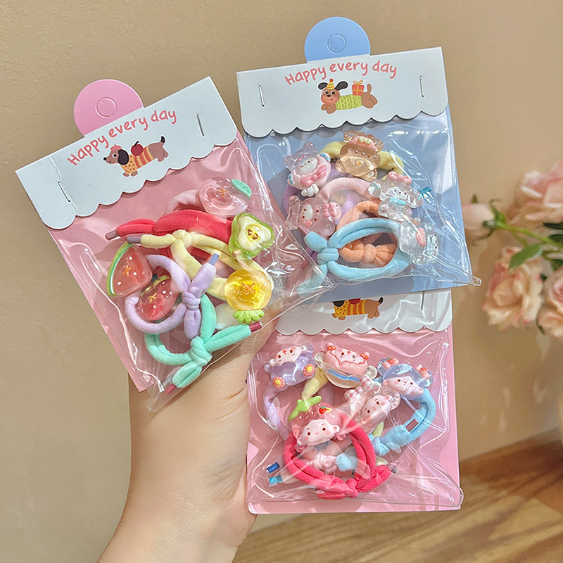 Cute cartoon fabric thumb ring hair tie for children and babies that won't hurt their hair. Bow and small rubber band to tie the little chirping hair tie full figure