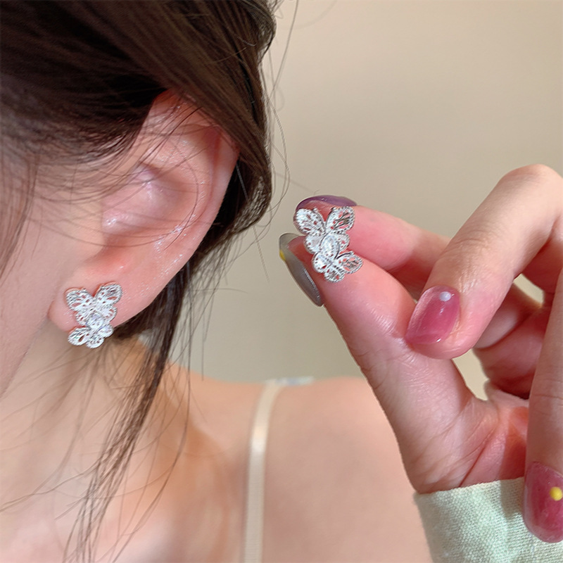 The cool and unique hollowed-out butterfly stud earrings feature a super ethereal French retro and versatile design. They are small and delicate earrings for women details Picture