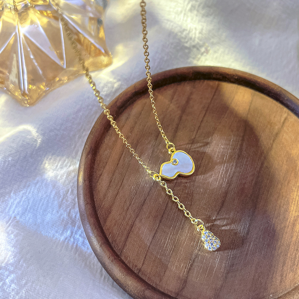 Korean version white shell tassel gourd pendant titanium steel necklace, a versatile and unique female style, a popular collarbone chain, a fashionable and light luxury accessory Specification drawing