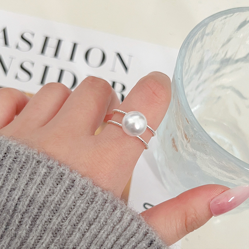 A new minimalist pearl imitation ring with a fashionable design for women, featuring an open double-layer design and a fresh and elegant European and American style. It is a joint ring full figure