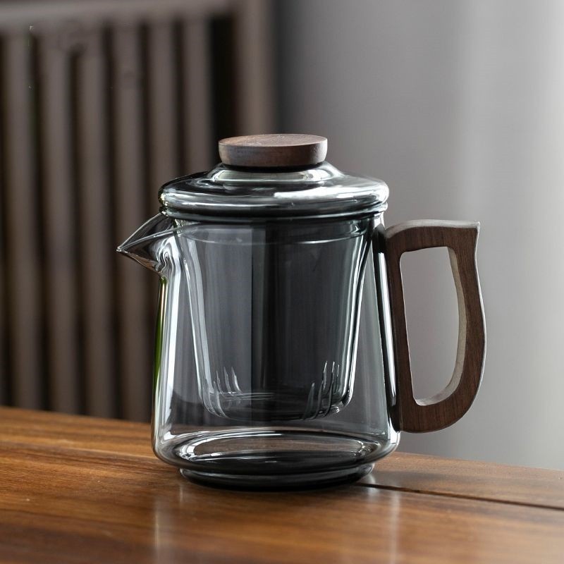 The Hehuan teapot, heat-resistant glass wood, complete set of teapot and tea ware, high borosilicate tea brewing and boiling utensils, tea and water separation flower teapot details Picture