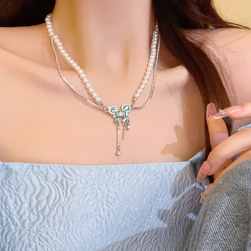 This ultra-ethereal and light luxury blue butterfly pearl necklace exudes a sense of high-end women. It features a double-layered diamond-encrusted tassel collarbone chain accessory Specification drawing