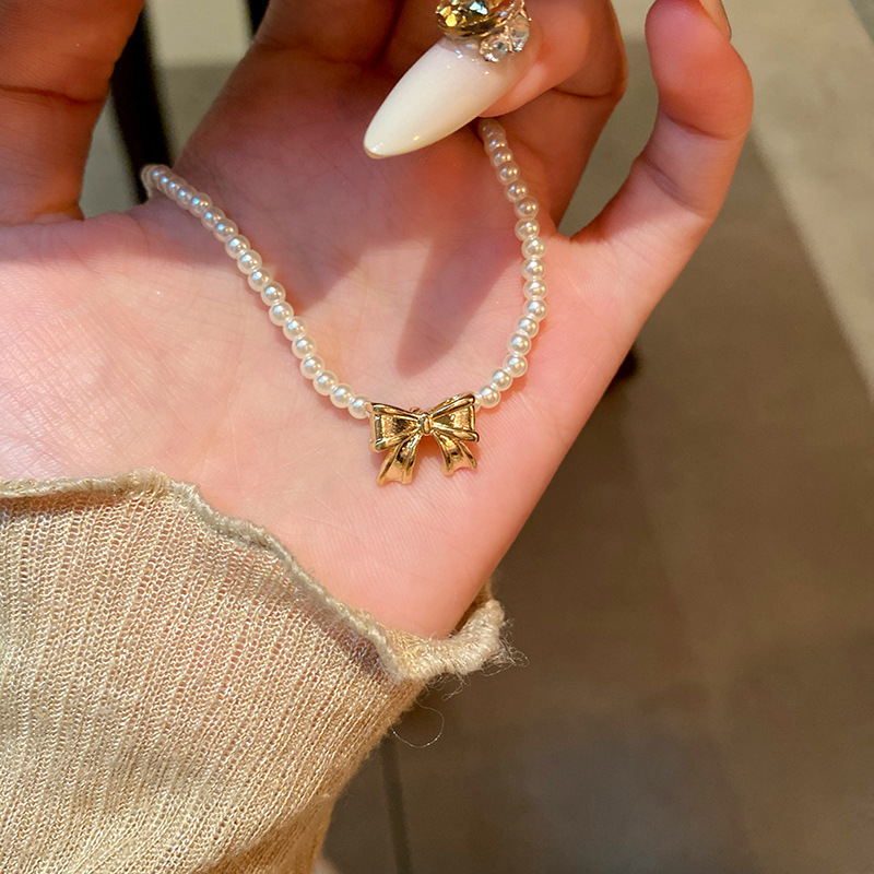 French retro bow pearl necklace, elegant and versatile for women, collarbone chain, light luxury, internet-famous neckchain accessory Specification drawing