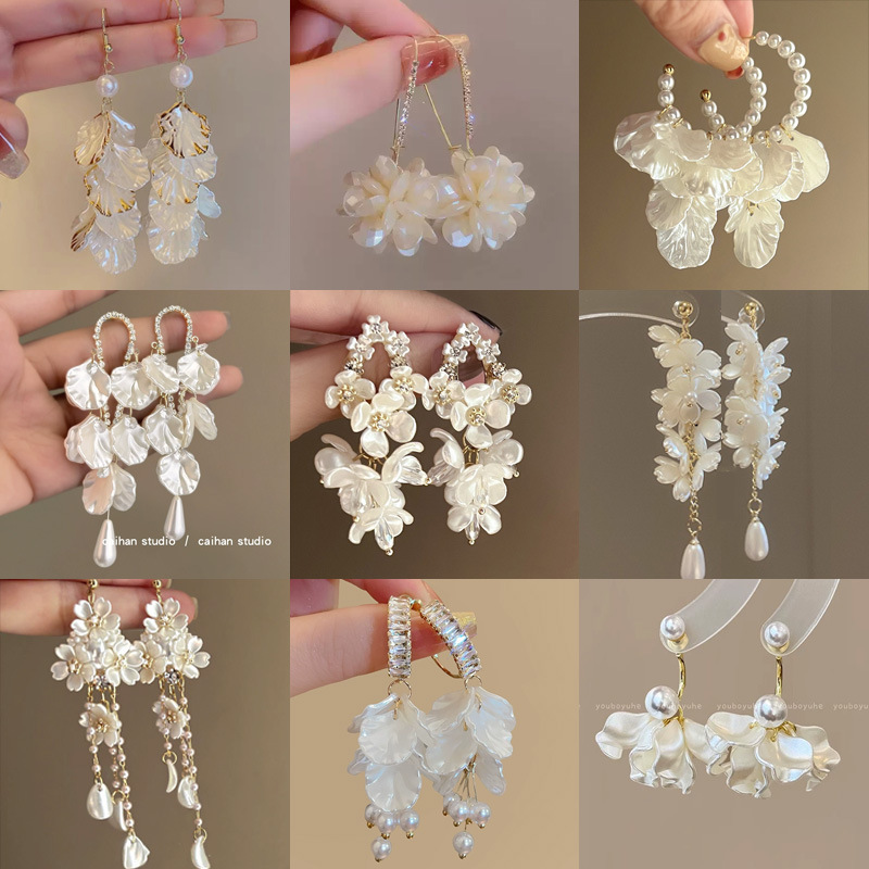 Silver needle diamond-encrusted pearl petal tassel stud earrings, fashionable, versatile and high-end earrings, niche commuter earrings wholesale for women full figure