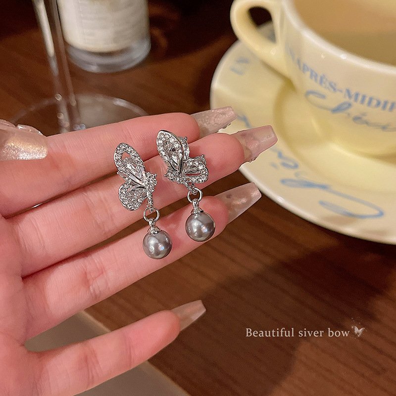 Grey butterfly pearl earrings for women, light luxury, niche, high-end, versatile and elegant bestsellers. Wholesale of 925 silver needle earrings full figure