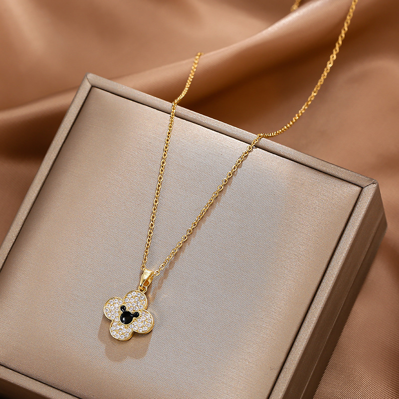 A genuine gold electroplated and slightly inlaid zircon four-leaf clover necklace with a unique and light luxury design for women, a collarbone chain that is a versatile accessory for Internet celebrities full figure